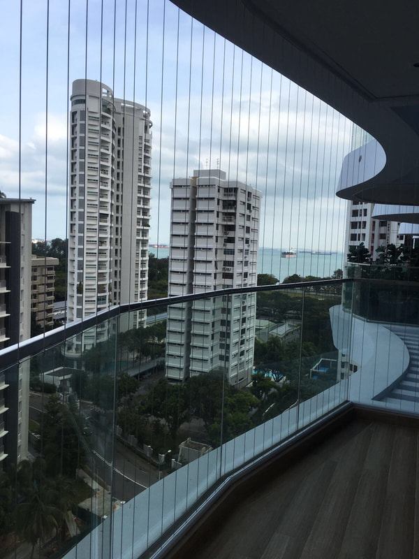 Invisible grille on curved balcony