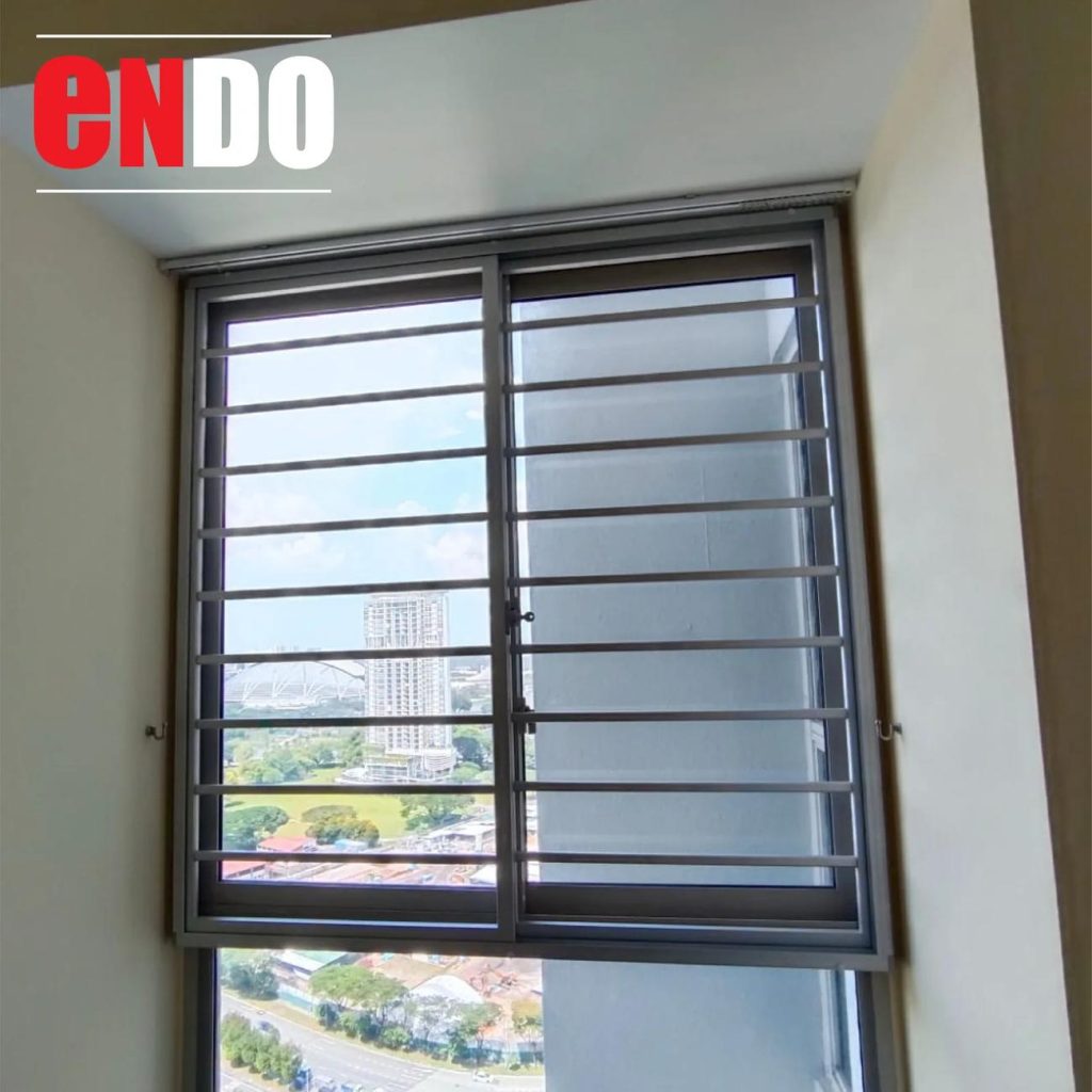 Aluminium grille sliding window in corner unit, view of stadium and city