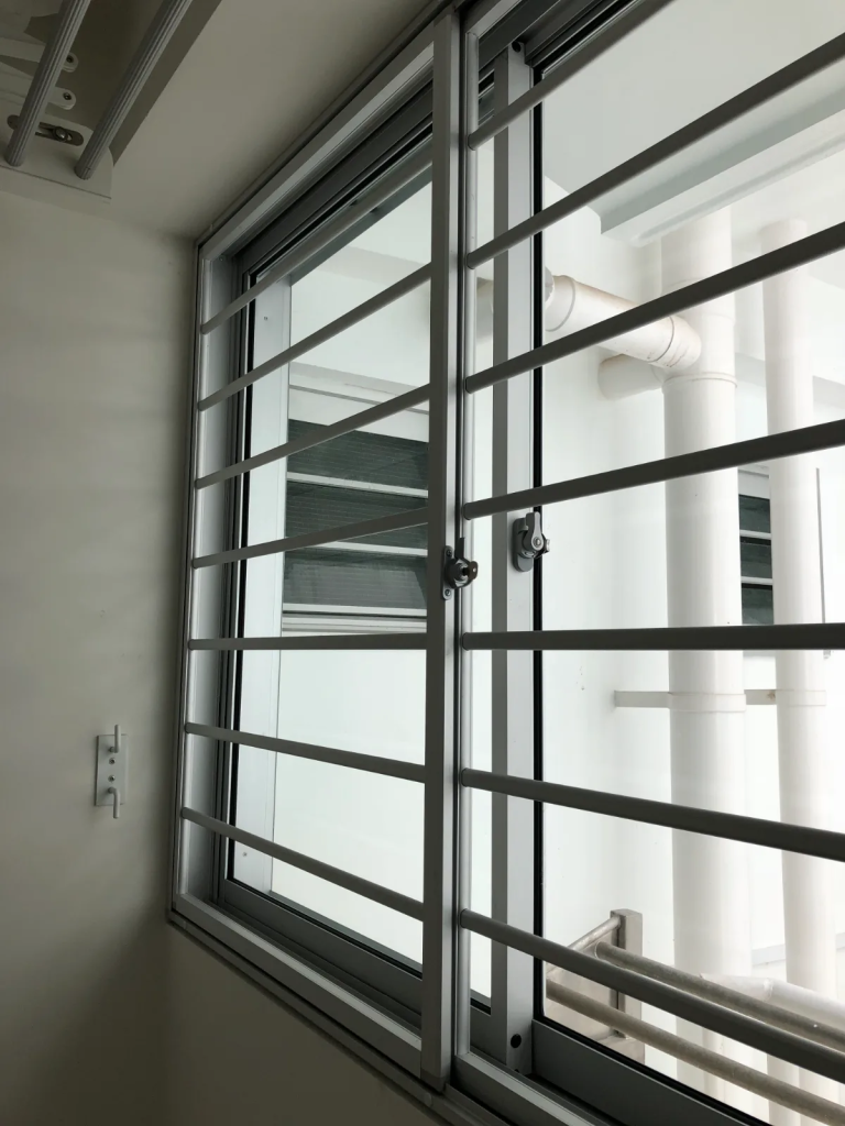 Aluminium service yard window grille installed in an HDB flat, Singapore