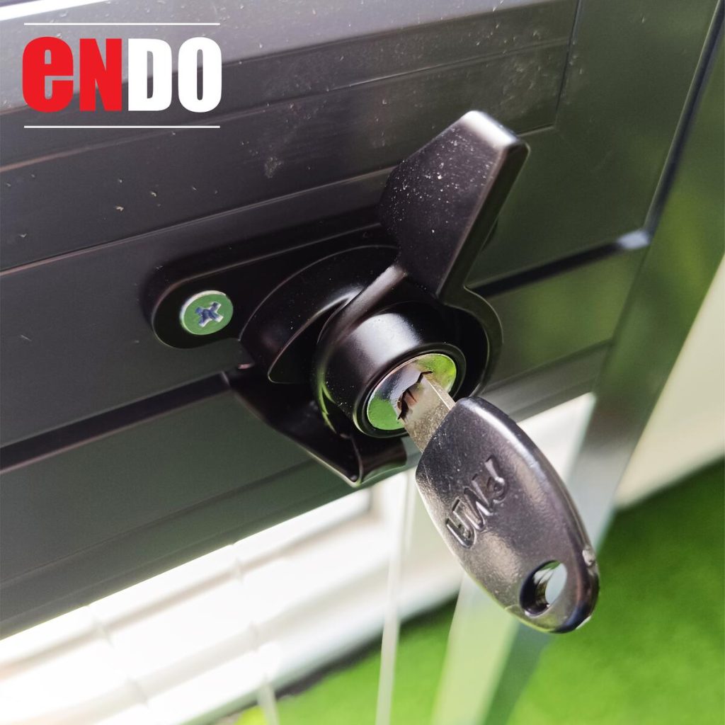 Close-up of casement swing invisible grille lock and key
