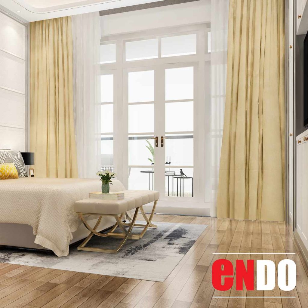 Gold day and night curtains in a condo bedroom with balcony sliding doors