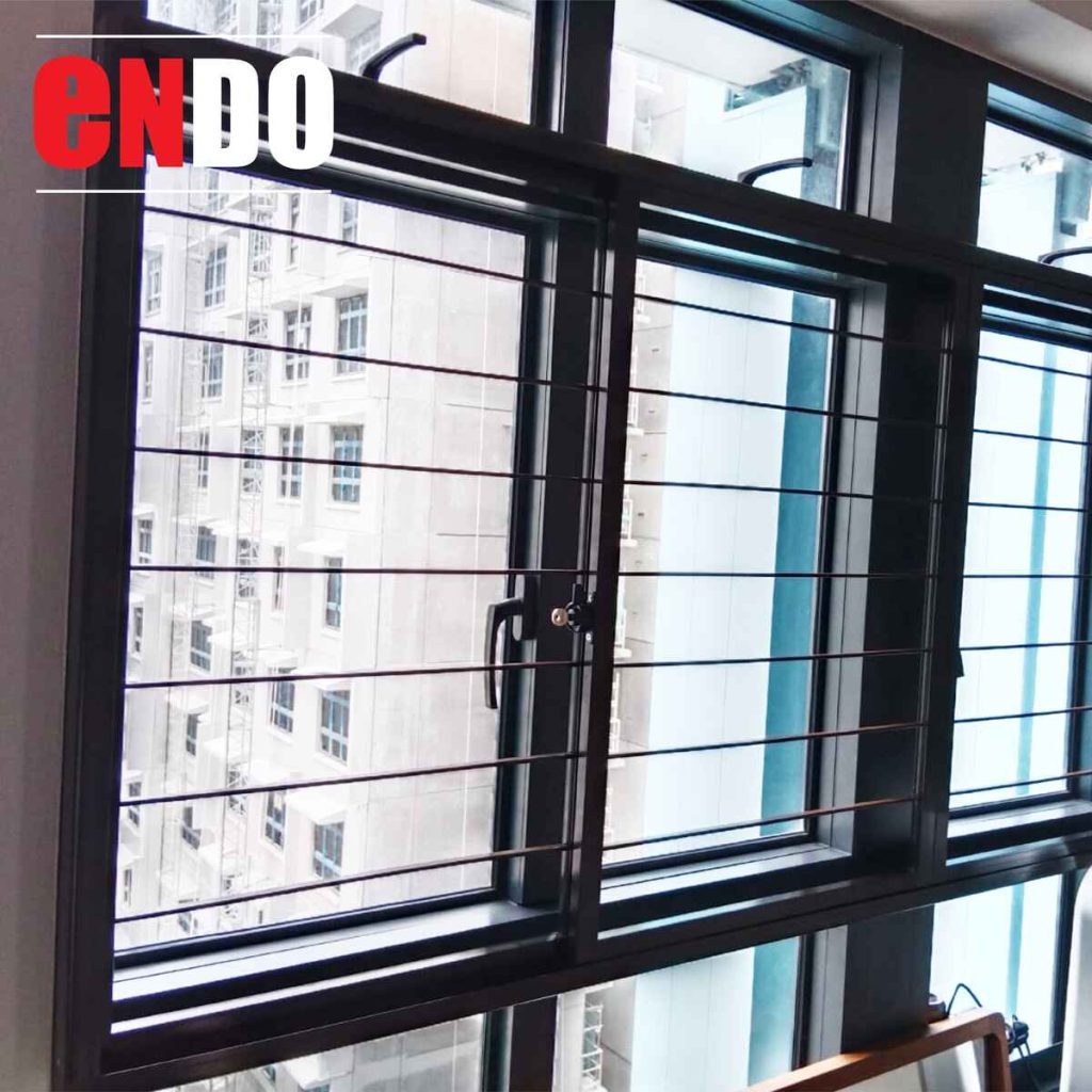 Sleek security grille on wide window with panoramic skyline view