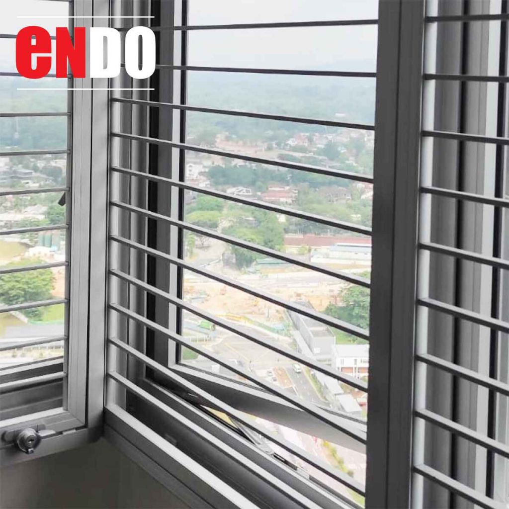 Sleek security grille on sliding window against green accent wall