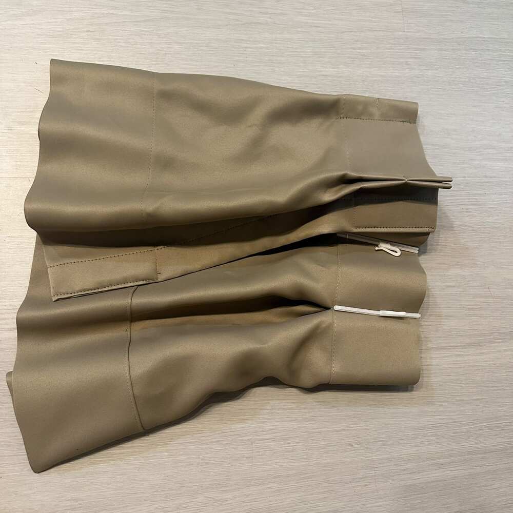 Ezi Wash technology curtain folded for washing with hooks still attached — wash the whole curtain hooks and all