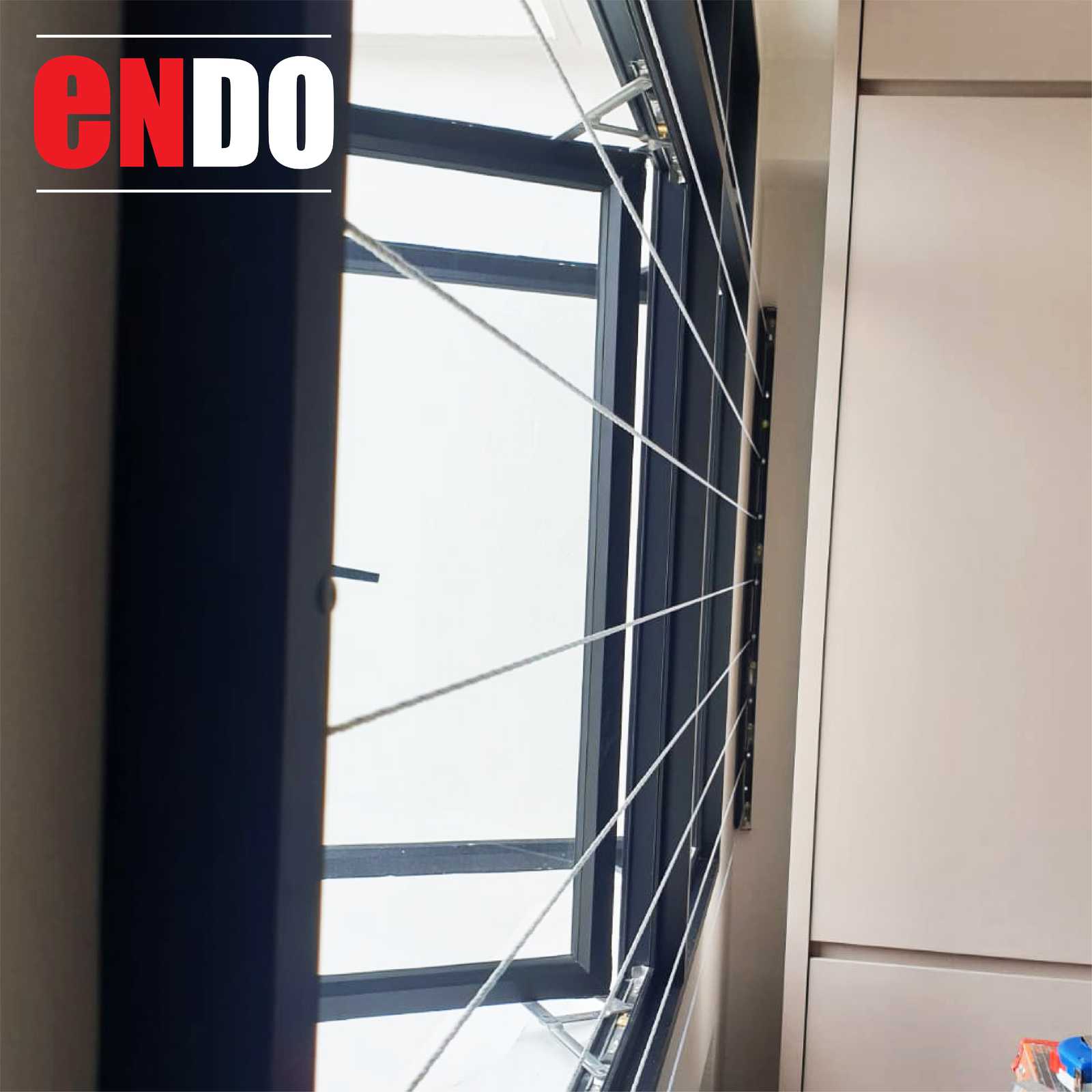 Invisible grille cables on an open casement window, interior angle view