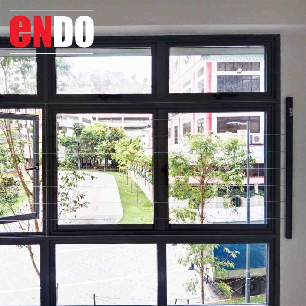 Fixed type Invisible grille on casement windows overlooking a grassy compound