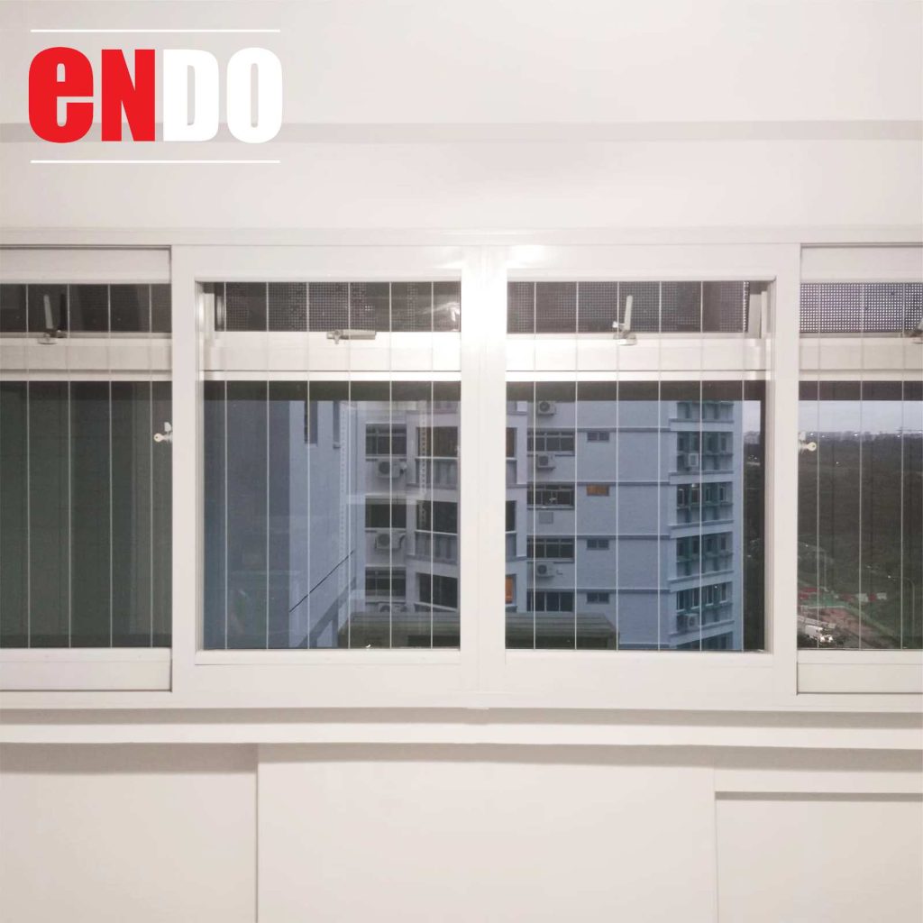Invisible grille on white-framed sliding windows with HDB view