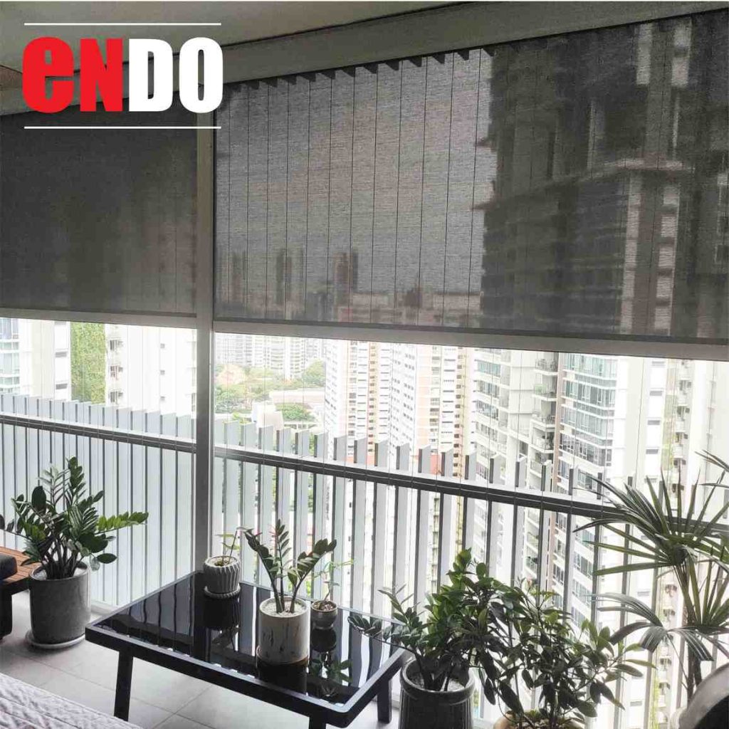 Grey zip blinds lowered in a garden conservatory with a glass roof, surrounded by potted plants and greenery